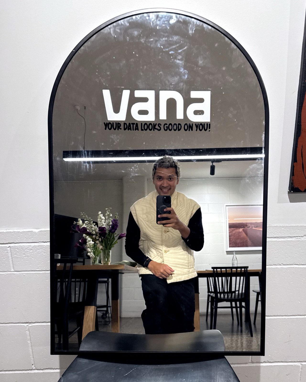 A branded Vana mirror reading "Your data looks good on you!"